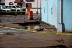A hole where a fire hydrant was damaged, causing flooding and damage to pavement, is seen near N. Main Street and Hadley Avenue in downtown Las Cruces on Friday, Jan. 12.